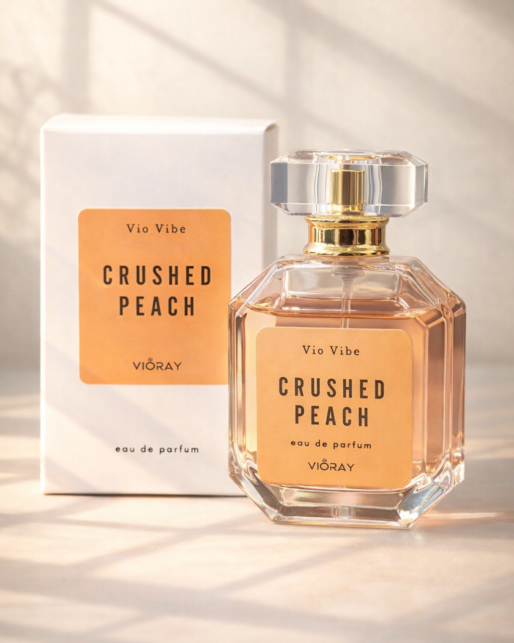 Vie Vibe Crushed Peach perfume bottle and packaging on a light background
